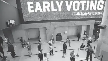  ?? JESSICA MCGOWAN/ GETTY IMAGES ?? The NBA Atlanta Hawks’ State Farm Arena is one of many profession­al sports arenas and stadiums that are being used as voting or drop- off ballot sites this fall.