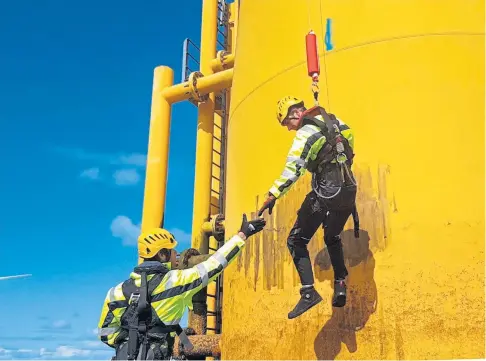  ??  ?? ON THE UP: Personnel on a wind turbine use the Get Up Safe hoist system developed by Pict Offshore.