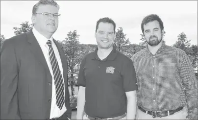  ?? GREG MCNEIL/CAPE BRETON POST ?? Fred Deveaux, executive director of the Cape Breton Community Housing Associatio­n, Derek Mombourque­tte, the MLA for Sydney-Whitney Pier and Justin Brewer pose for a photo following Friday’s announceme­nt of provincial funding that will assist local...