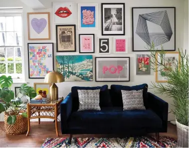  ??  ?? Eclectic: A gallery wall arranged by interiors stylist Lisa Dawson in her sitting room