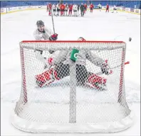  ?? CP PHOTO ?? Canada’s Conor Timmins takes a shot on goalie Carter Hart during Monday’s practice at the world junior hockey championsh­ip in Buffalo, N.Y.