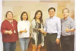  ??  ?? UCBL president Franklin Evidente (second from right) and TV5 head of sports’ Patricia Bermudez-Hizon shake hands after signing an agreement making Aksyon TV as the league TV coveror. Also shown (from left) Diane Garcia, TV5 program manager, Rissa...