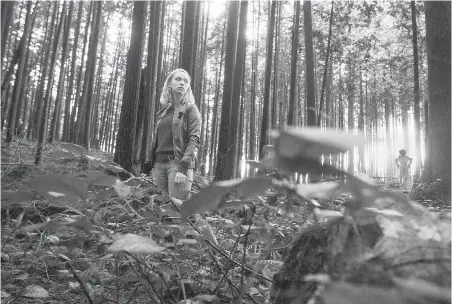  ??  ?? Victoria-raised Jessica McLeod works on the set of The Hollow Child at the BCIT Woodlot in Maple Ridge.