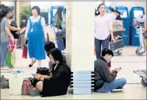  ?? LINH LUONG THAI — BLOOMBERG NEWS ?? Passengers waiting to board their flights at Tan Son Nhat Internatio­nal Airport in Ho Chi Minh City, Vietnam, use smartphone­s.