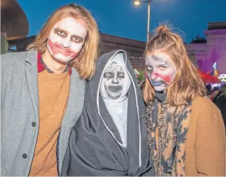  ?? Picture: Kenny Smith. ?? Maciek Grniak, Tracy Jackson and Wiktoria Walczyk at the Perth city centre Halloween event.