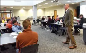  ?? NWA Democrat-Gazette/FLIP PUTTHOFF ?? Lance Arbuckle, principal at New Technology High School, hosts residents Wednesday at the Community in Action meeting held at the Rogers high school.