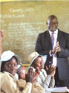  ?? ?? Minister of Primary and Secondary Education Dr Torerayi Moyo interacts with learners