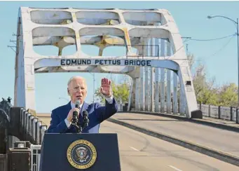  ?? Megan Ngan/Tribune News Service ?? President Joe Biden marks the 58th anniversar­y of “Bloody Sunday,” a key moment in the civil rights movement, on Sunday at the Edmund Pettus Bridge in Selma, Ala.