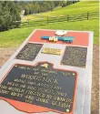  ?? JAMES KIRKIKIS/DREAMSTIME ?? A plaque at the field of the 1969 Woodstock concert.