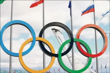  ?? MARTIN ROSE / GETTY IMAGES ?? If a Russian athlete wins an event, the Olympic flag would be raised and the Olympic anthem played to honor a victory. That is, if Russian President Vladimir Putin allows them to go to the Feb. 9-25 games.