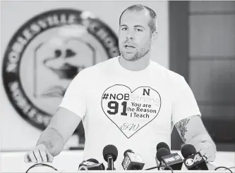  ?? MICHAEL CONROY THE ASSOCIATED PRESS ?? Jason Seaman was shot while tackling and disarming an armed student who entered his classroom.