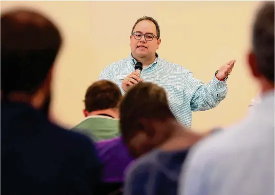  ?? Photos by Jerry Lara/Staff photograph­er ?? Alberto Rodriguez, vice president of transforma­tional services at Haven for Hope, speaks with clients during a town hall meeting on June 27.