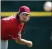  ?? NATHAN DENETTE — THE CANADIAN PRESS VIA AP ?? Philadelph­ia Phillies starting pitcher Aaron Nola warms up before a spring training baseball game against the Toronto Blue Jays in Dunedin, Fla. Thursday.