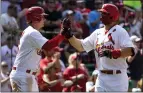  ?? JEFF ROBERSON — THE ASSOCIATED PRESS ?? The Cardinals' Paul Goldschmid­t, right, is congratula­ted by Nolan Gorman after hitting a two-run homer in the seventh inning Monday.