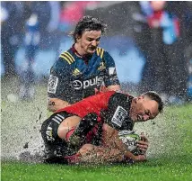  ?? PHOTO: PHOTOSPORT ?? The weather was the overriding factor in the Super Rugby quarter-final on Saturday night in Christchur­ch.