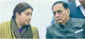  ?? —PTI ?? Union textile minister Smriti Irani along with Gujarat CM Vijay Rupani during the Textile Conclave in Gandhinaga­r, Sunday.