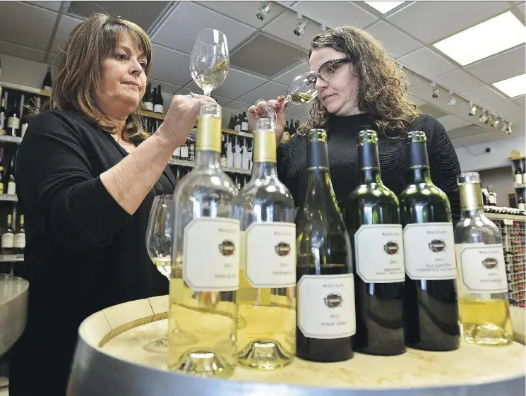  ?? ED KAISER ?? Angela Maculan, right, a co-owner of Italy’s Maculan Winery tastes wine with Juanita Roos, who owns Color de Vino. Women are making their mark in the wine world, Roos writes.