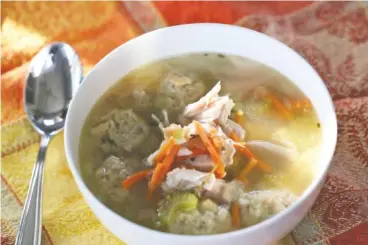  ?? JESSICA J. TREVINO/DETROIT FREE PRESS ?? Turkey soup with stuffing dumplings makes use of many Thanksgivi­ng leftovers — turkey carcass, turkey meat, stuffing and vegetables.