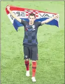  ?? THANASSIS STAVRAKIS — THE ASSOCIATED PRESS ?? Croatia’s Mario Mandzukic celebrates after a rousing 2-1 semifinal win over England.
