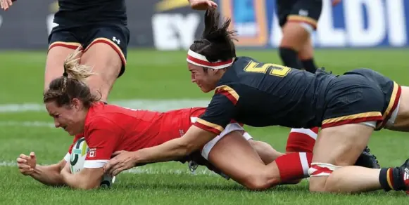  ?? DAVID ROGERS PHOTOS/GETTY IMAGES ?? Lori Josephson dives over for Canada’s first try against Wales in Dublin, Ireland, on Sunday. Unscored upon through two games, Canada next faces powerhouse New Zealand on Thursday.