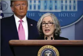  ?? EVAN VUCCI — THE ASSOCIATED PRESS FILE ?? Anne Schuchat, principal deputy director of the Centers for Disease Control and Prevention, speaks Feb. 26 during a news conference about the coronaviru­s in the Brady Press Briefing Room of the White House in Washington as President Donald Trump stands behind her.