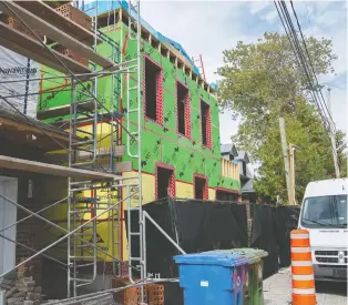  ?? PETER MCCABE ?? A new home is being built at 4 St. Joachim Ave. in Pointe-claire after an older home was demolished without a city permit last year. The owner was fined $25,000.