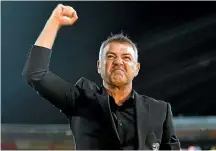  ?? PHOTOSPORT ?? Wellington Phoenix coach Mark Rudan celebrates the team’s third-straight win last weekend.