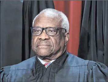  ?? J. Scott Applewhite
The Associated Press ?? A challenge to the Biden administra­tion’s college loan forgivenes­s plan has reached the Supreme Court. Justice Clarence Thomas is unlikely to vote in the administra­tion’s favor.
