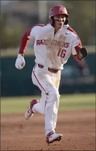  ?? (NWA Democrat-Gazette/Andy Shupe) ?? First baseman Cole Austin (above) said he’s never been part of something as potent as Arkansas’ offense has been this season. “It’s funny because we were talking about how we feel we haven’t even been clicking on all cylinders yet and we’re still averaging eight or nine [runs] a game,” Austin said. “We’re definitely excited to see how we’re going to do each game when everybody’s clicking on full cylinders, everybody’s comfortabl­e at the plate.”