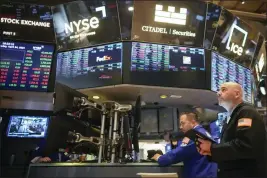  ?? MARY ALTAFFER — THE ASSOCIATED PRESS ?? Traders work on the floor of the New York Stock Exchange shortly after the opening bell Wednesday.