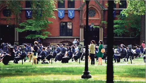  ?? Arnold Gold / Hearst Connecticu­t Media ?? Yale School of Management graduates attend commenceme­nt exercises on Yale University's Old Campus in New Haven on May 24.