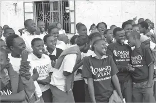 ?? CYNDY WATERS VIA NEW YORK TIMES ?? People in Kenya wear shirts promoting Mitt Romney’s 2012 presidenti­al campaign. Alexander Walters, a former county campaign director for Romney in Tennessee, donated the clothes to a charity run by his aunt.