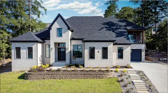  ?? SUBMITTED PHOTOS ?? In addition to five bedrooms and five-and-a-half baths, this newly constructe­d home in Chenal Valley in Little Rock provides a spacious chef’s kitchen, a spalike bath and a covered balcony.