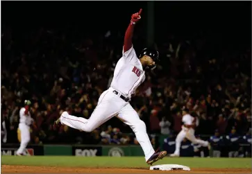  ?? AP PHOTO BY DAVID J. PHILLIP ?? Boston Red Sox’s Eduardo Nunez reacts as he runs the bases after hitting a three-run home run during the seventh inning of Game 1 of the World Series baseball game against the Los Angeles Dodgers Tuesday, Oct. 23, in Boston.