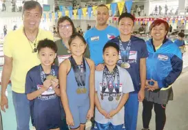  ??  ?? Philippine Swimming League president Susan Papa, NCR regional director Joan Mojdeh, coaches Alex Papa and Jeffrey Medrano with gold medalists Marc Bryan Dula, Micaela Jasmine Mojdeh, Rio Lorenzo Malapitan and Trump Christian Luistro.