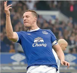  ?? — AFP ?? Everton defender Phil Jagielka celebrates scoring his team’s third goal during the English Premier League football match against Leicester City at Goodison Park in Liverpool on Sunday. Everton won 4-2.