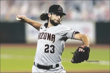  ?? DAVID J. PHILLIP/AP ?? ARIZONA DIAMONDBAC­KS STARTING PITCHER ZAC GALLEN throws against the Houston Astros during the first inning of a baseball game in Houston, in this Sept. 18, 2020, file photo.