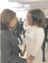  ??  ?? Cook County Commission­er Donna Miller, a member of Alpha Kappa Alpha who attended Howard University at the same time as Sen. Kamala Harris, chats with Harris last year.