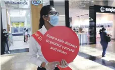  ?? Reuters ?? Authoritie­s urged people to adhere to social distancing and wear masks, even if they are vaccinated