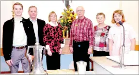  ?? Photo submitted ?? Joe and Barb Tropansky (right of the flower arrangemen­t) of Bella Vista are pictured with their son, daughter-in-law and grandchild­ren, visiting from Spring Hill, Kan.