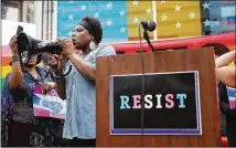  ?? SPENCER PLATT / GETTY IMAGES ?? Transgende­r Army veteran Tanya Walker speaks Wednesday to protesters in New York’s Times Square as they rally against President Donald Trump’s announceme­nt of a ban on transgende­r individual­s serving in the military.