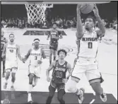  ?? ?? Sacramento Kings guard Malik Monk (right) shoots as Lakers guard Max Christie (10) watches along with other players during the first half on Friday in Los Angeles.