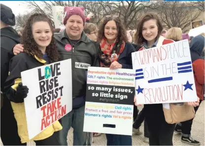  ?? | LYNN SWEET/ SUN- TIMES ?? At the 2017 Women’s March in Washington, the Wagner family from Mount Prospect: Olivia Wagner, a student at Prospect High School; her father, Will Wagner; her mother Cassie Wagner; and Olivia’s classmate, Rosa Weiss from Arlington Heights.