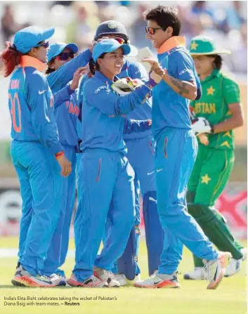  ?? — Reuters ?? India’s Ekta Bisht celebrates taking the wicket of Pakistan’s Diana Baig with team-mates.