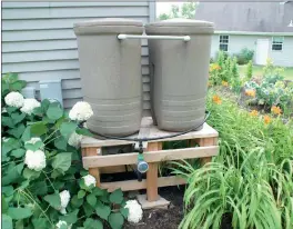  ?? Photo courtesy of MelindaMye­rs.com ?? Elevate your rain barrel for easier access to the spigot for filling containers and to speed water flow with the help of gravity.