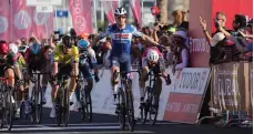  ?? AFP ?? Belgian rider Tim Merlier crosses the line after sprinting to victory in Stage 4 of the UAE Tour in Dubai