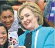  ?? DAMIAN DOVARGANES, AP ?? Democratic candidate Hillary Clinton takes a photo with supporters in Los Angeles.