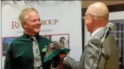  ?? TANIA BARRICKLO — DAILY FREEMAN FILE ?? Lyle Schuler, owner of MAC Fitness, left, after he was named ‘Honorary Irishman of the Year’ by the Ulster County Regional Chamber of Commerce in 2015in Kingston. At right is presenter Ward Todd.