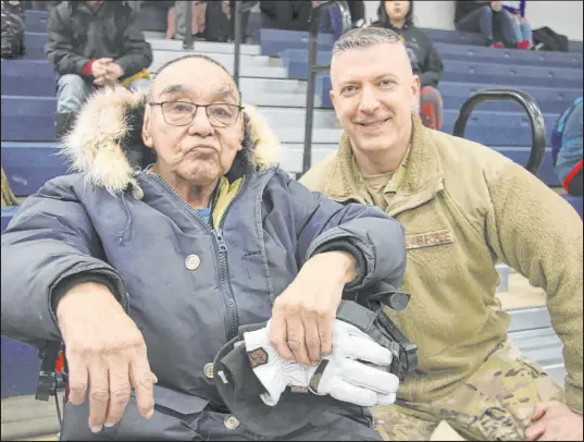  ?? Mark Thiessen
The Associated Press ?? Bruce Boolowon, 87, left, with Maj. Gen. Torrence Saxe, the adjutant general of the Alaska National Guard, during an awards ceremony on Tuesday in Gambell, Alaska. Boolowon and others were honored for their lifesaving actions in 1955.