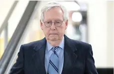  ?? Associated Press ?? ■ Senate Minority Leader Mitch McConnell, R-Ky. goes down an escalator Wednesday at the Capitol in Washington.